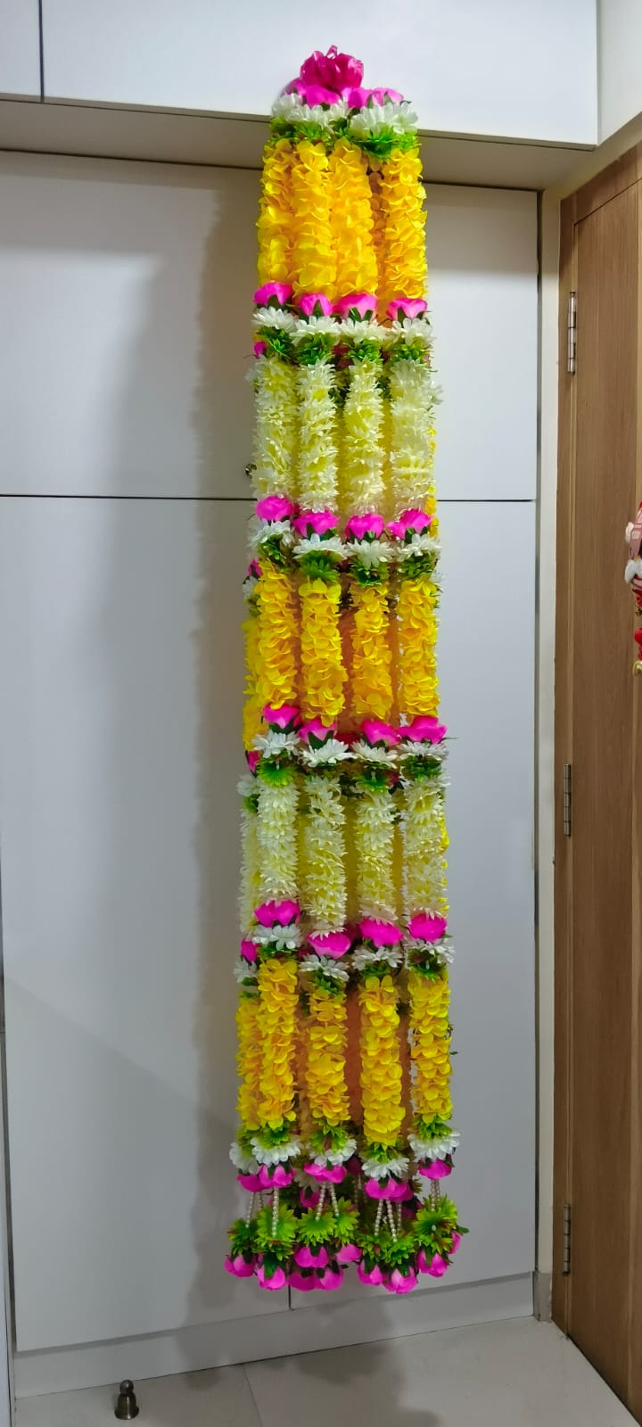 Original full-length view of multicolor artificial flower garland